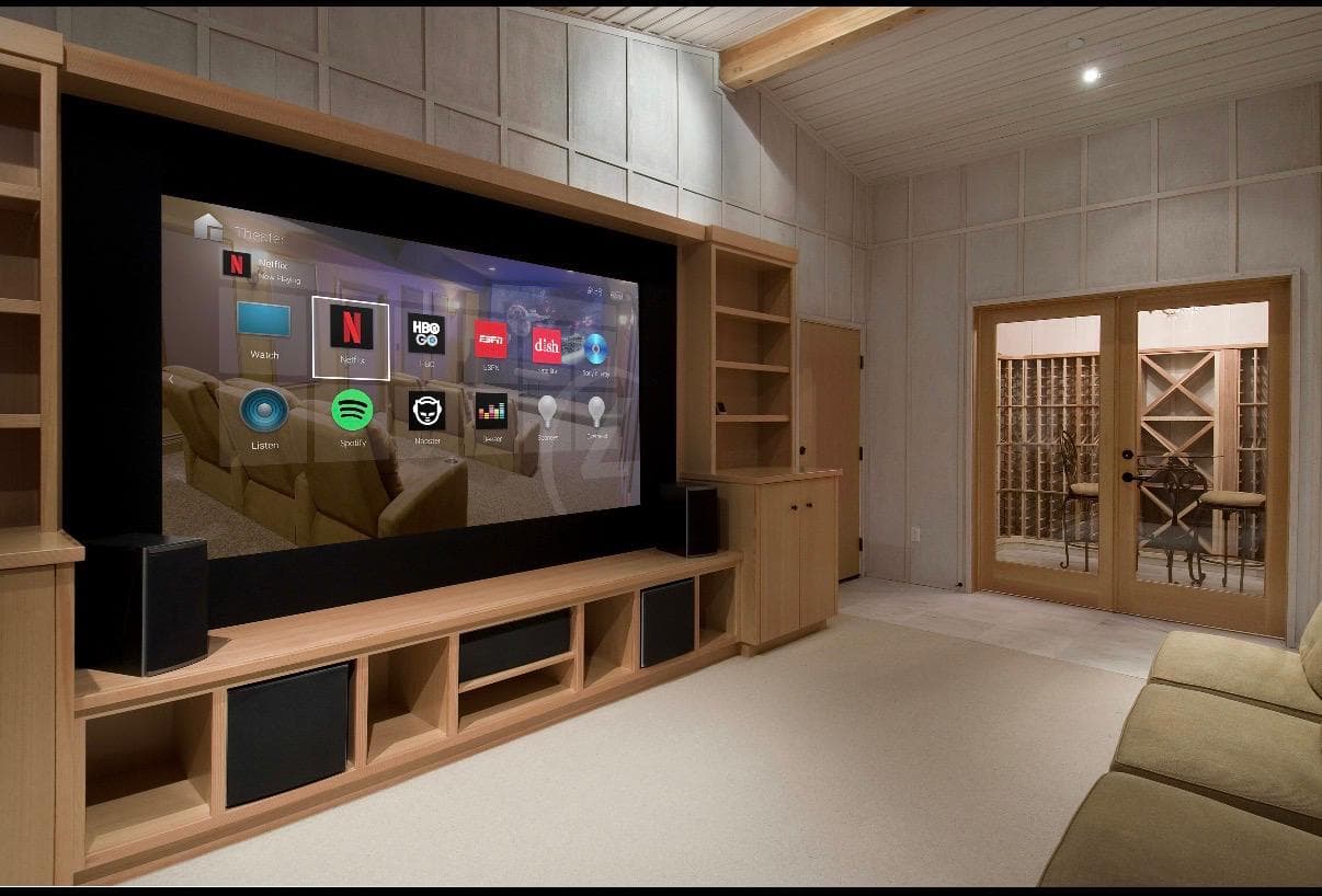 Home theatre with a projection screen and built-in audio equipment