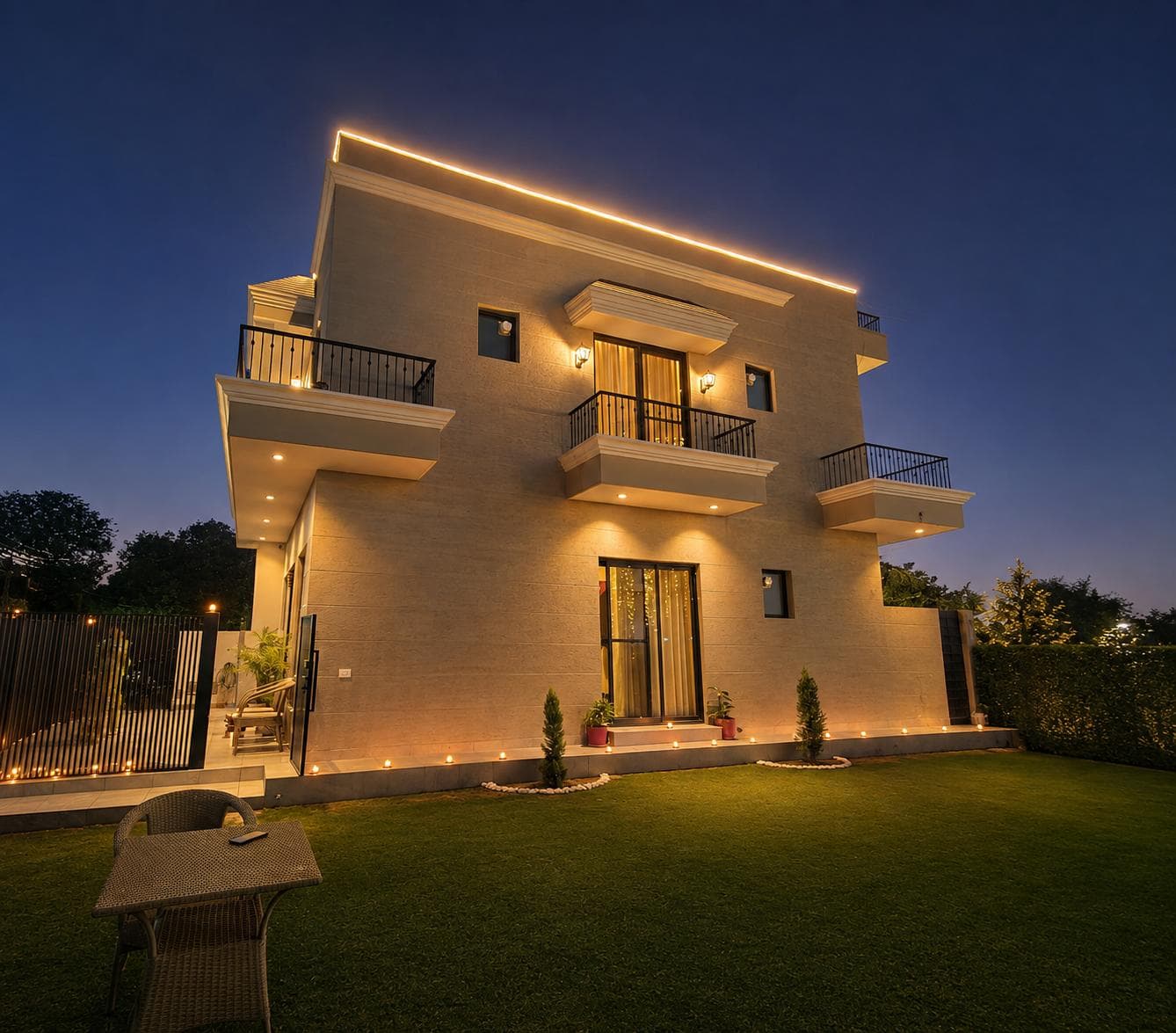 Contemporary residence illuminated with warm exterior lighting at dusk