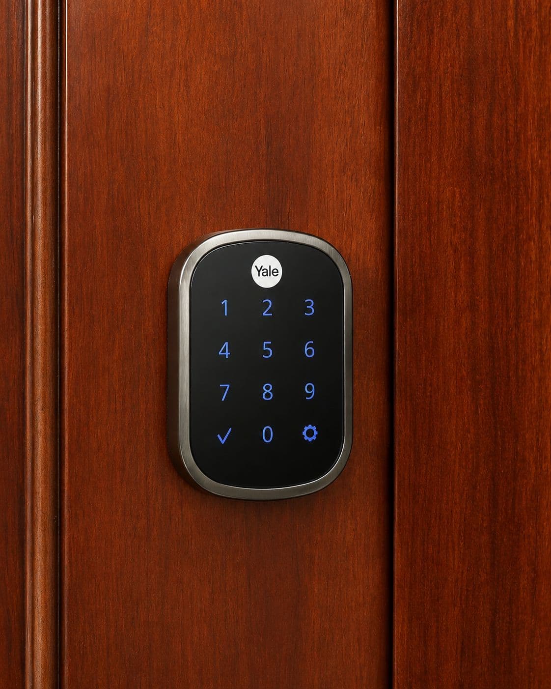 Illuminated keypad smart lock on a wooden door